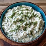 Cooling Skyr Tzatziki Dip, a vibrant green, perfect with pita and veggies.