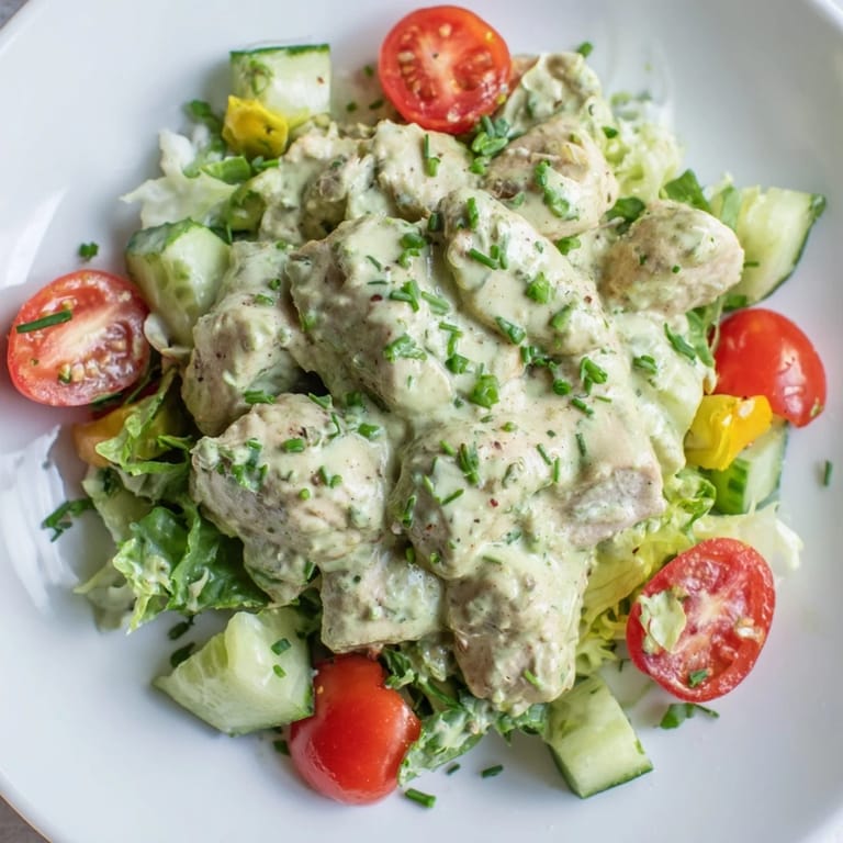 Fresh avocado ranch chicken salad with diced chicken, red onion, and celery, ready for a light lunch or dinner.