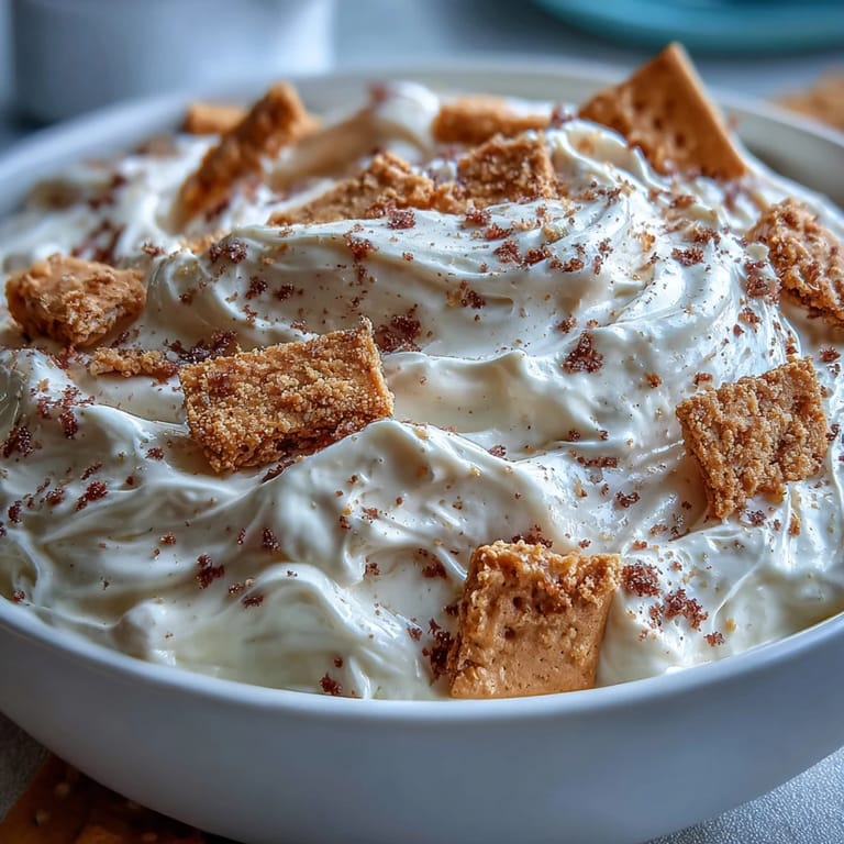 Velvety cheesecake dip ready for dunking with buttery graham cracker pieces.
